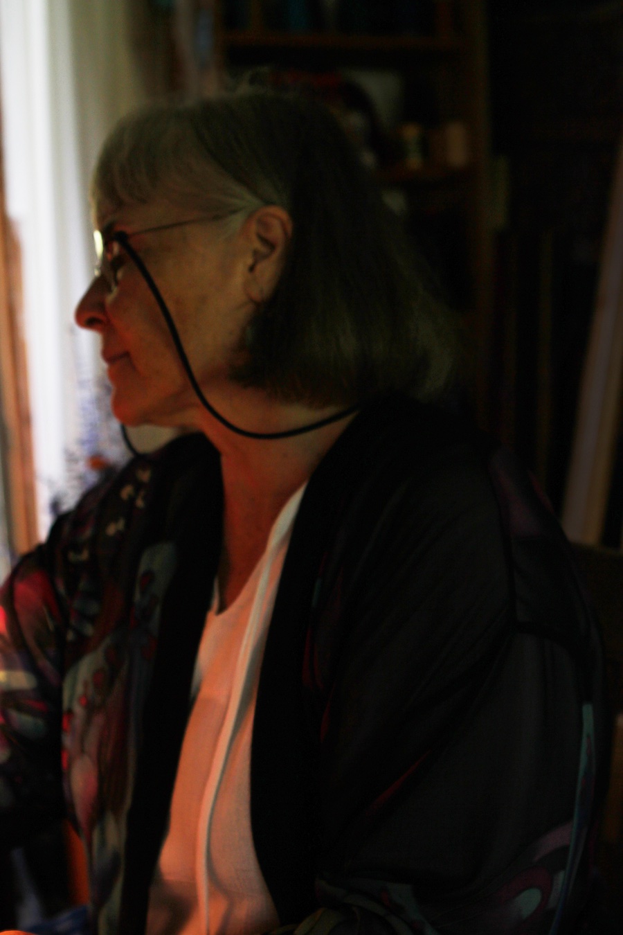 woman looking to the left in shadow