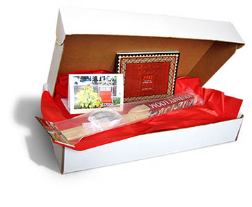 White box containing loom book and card